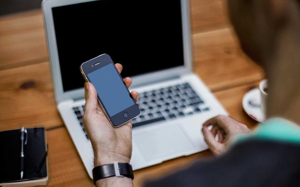 A hand holding a phone
